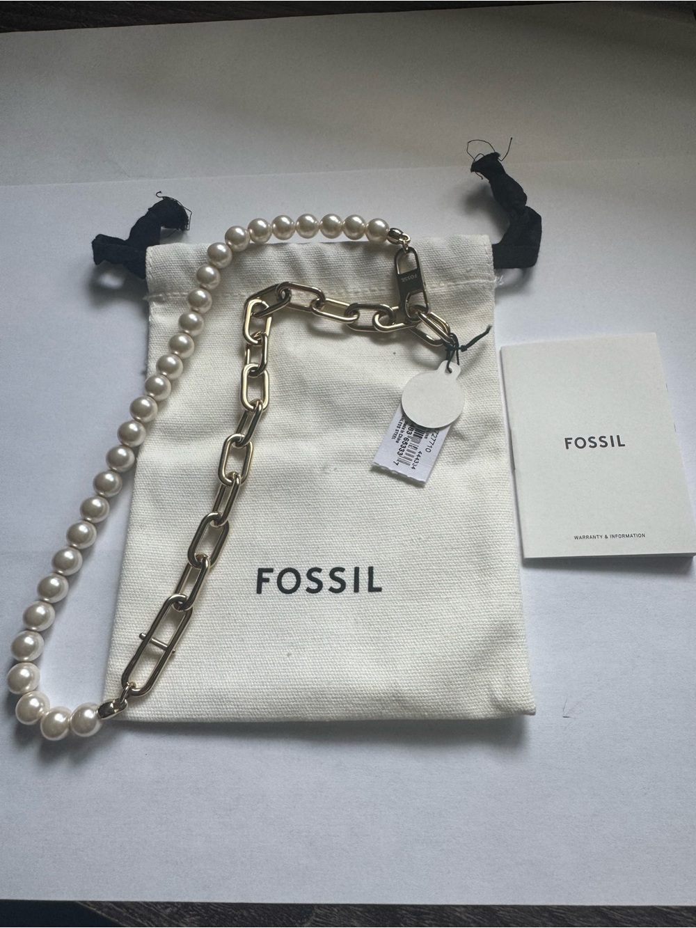 Fossil Heritage D-Link Gold-tone necklace. Stainless steel and white pearls